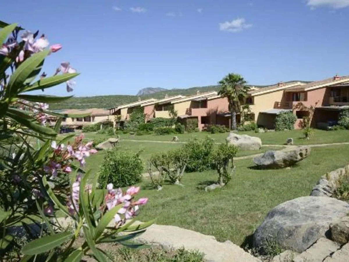 Inviting Holiday Home In Marinella With Shared Garden Italy