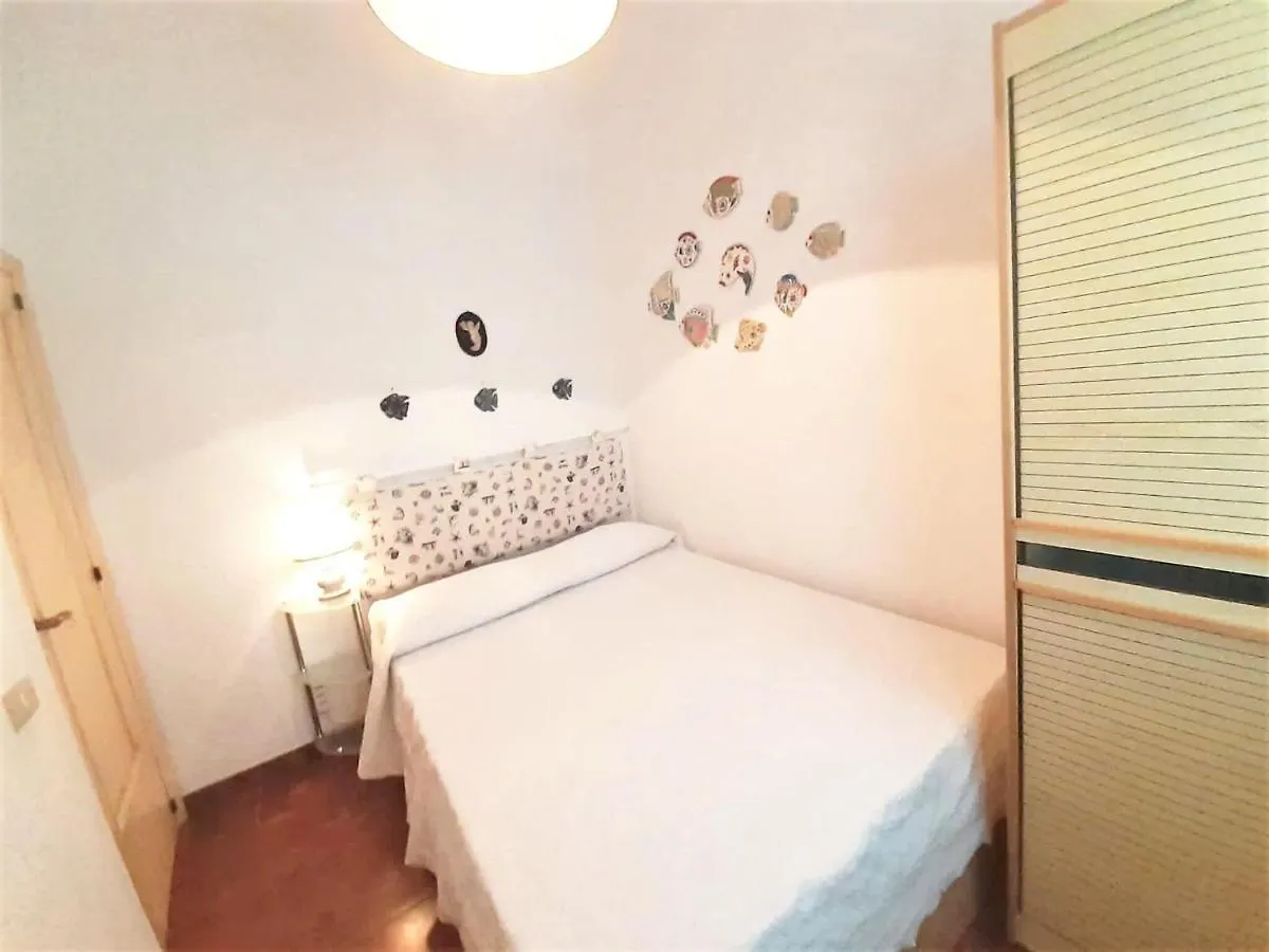 Inviting Holiday Home In Marinella With Shared Garden