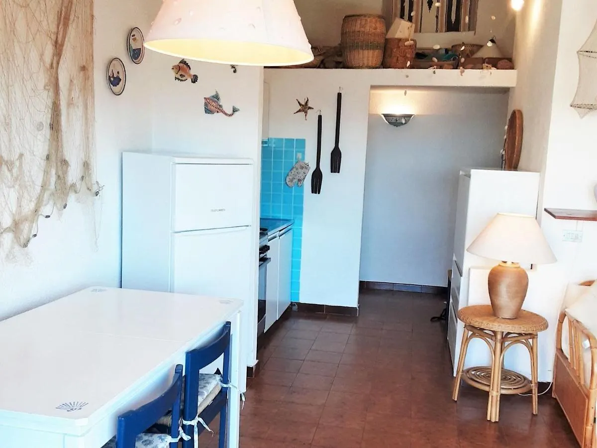 Inviting Holiday Home In Marinella With Shared Garden Italy